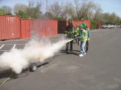 Firemen Testing Fire Extinguisher